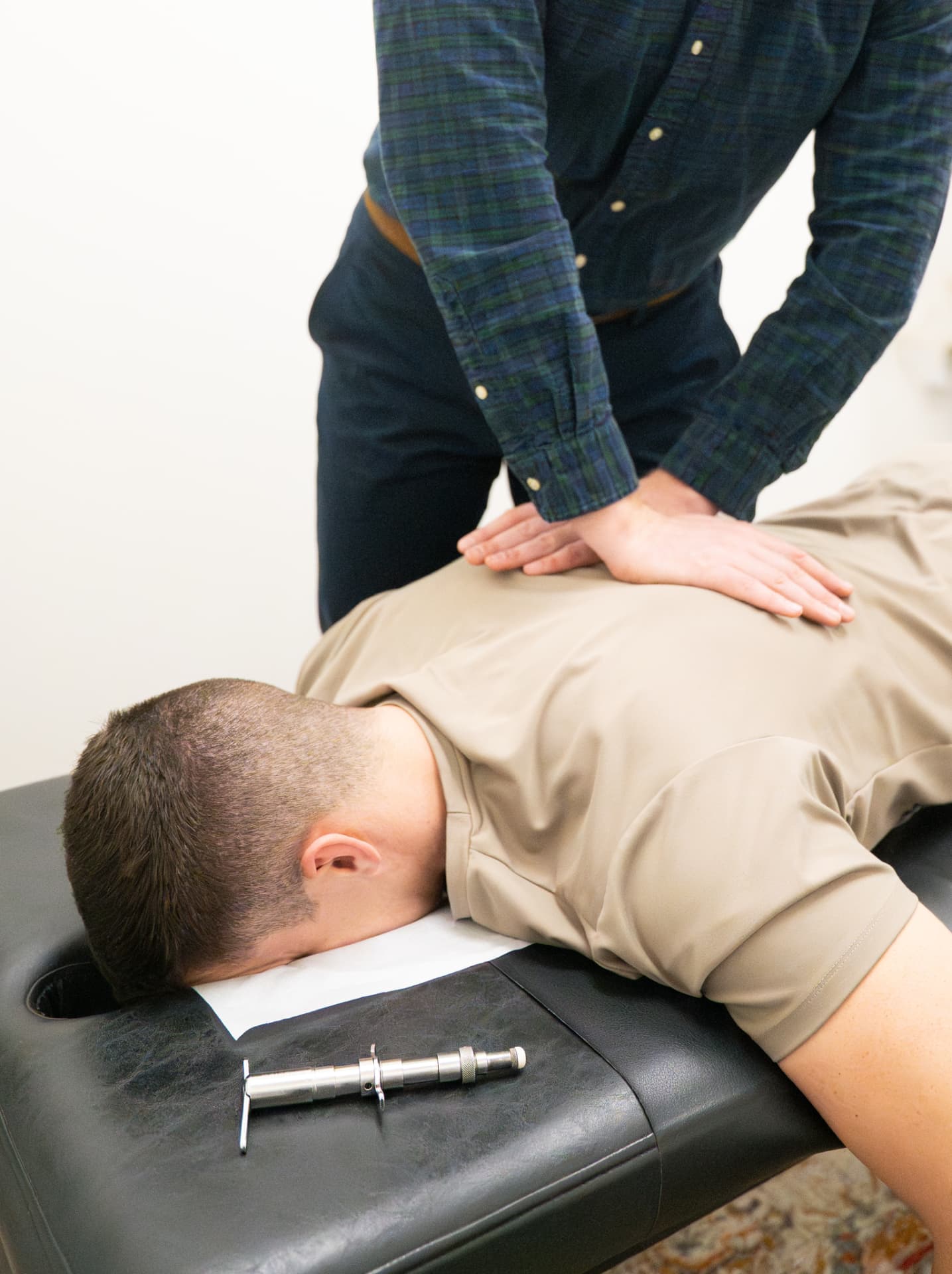 Patient receiving a chiropractic adjustment